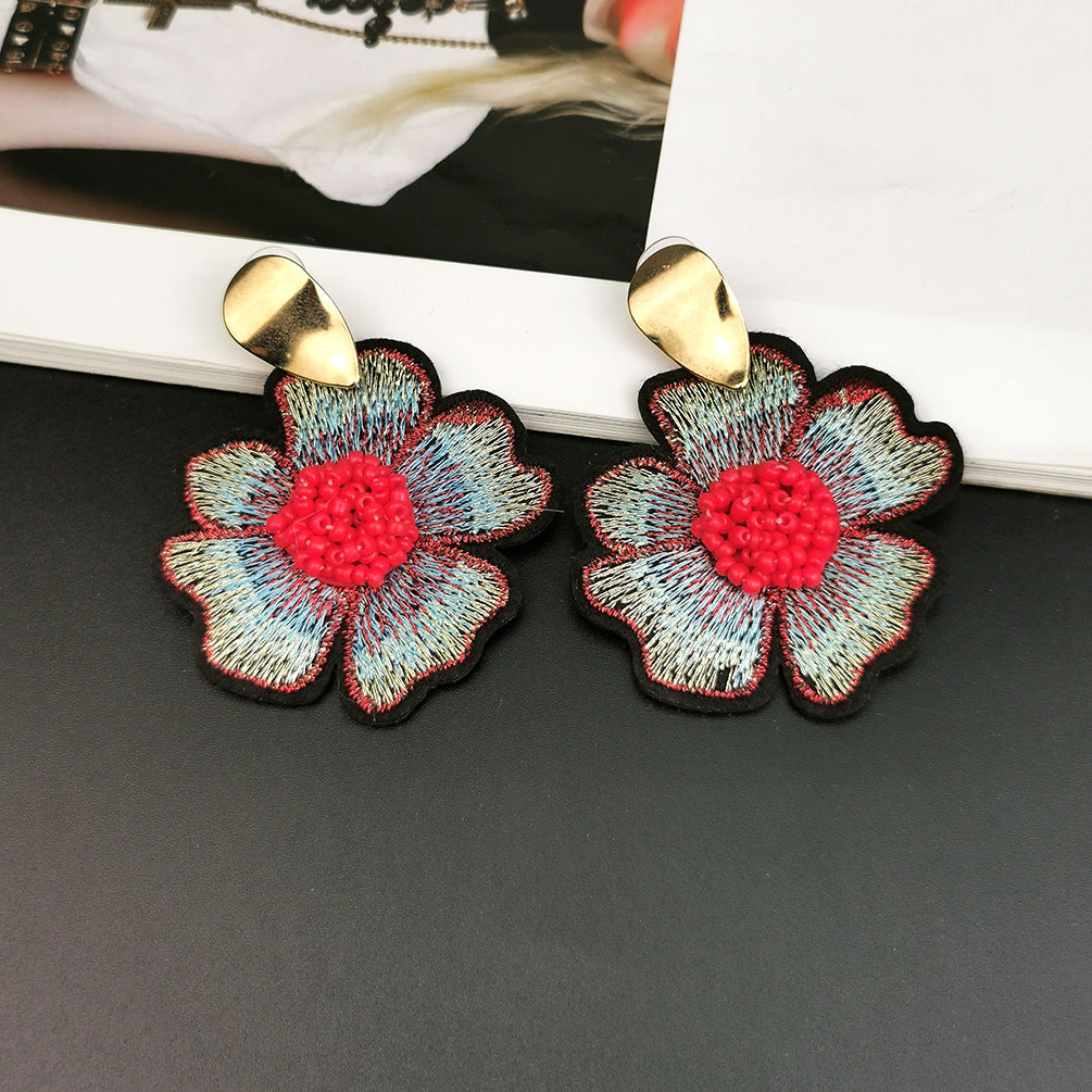 Japanese and Korean ins fashion all-match earrings female round rice bead flower pendant alloy earrings